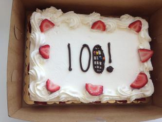 Cake with text that says 100!
