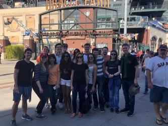 A group of people standing in front of Oracle Park